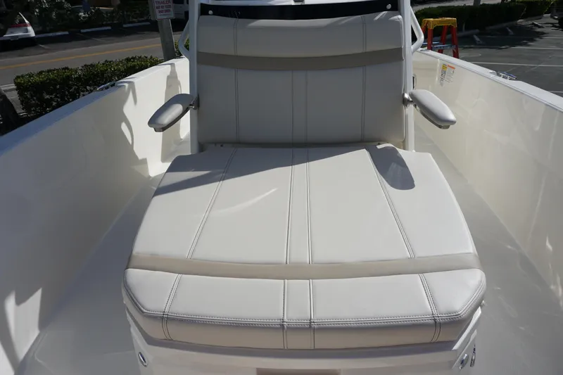 Slide: The Image of 2026 Boston Whaler 220 Dauntless boat seating, featuring comfortable white upholstery. - 21
