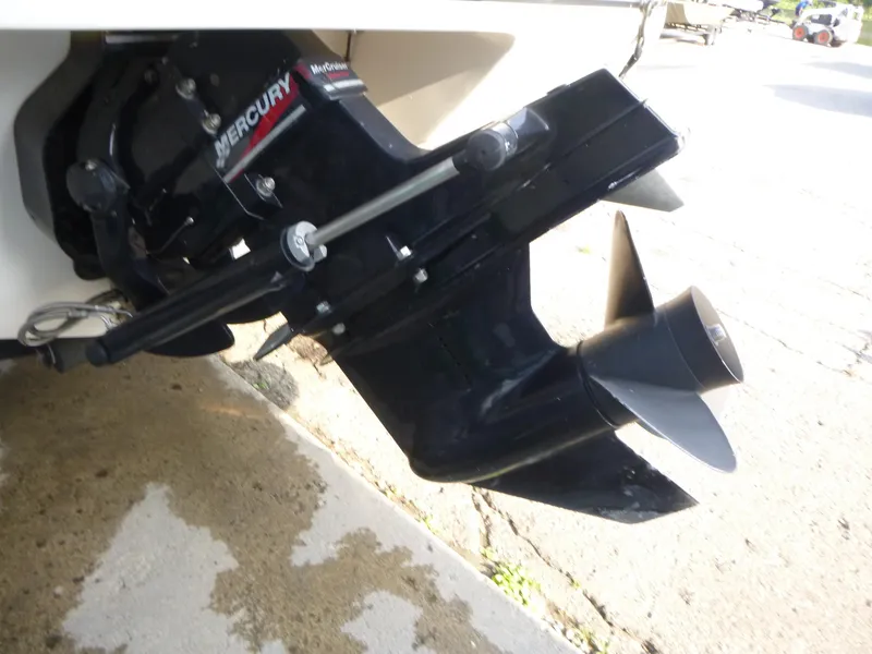 Slide: The Image of 2003 Rinker 180 BR boat with Mercury outboard motor, close-up view. - 14