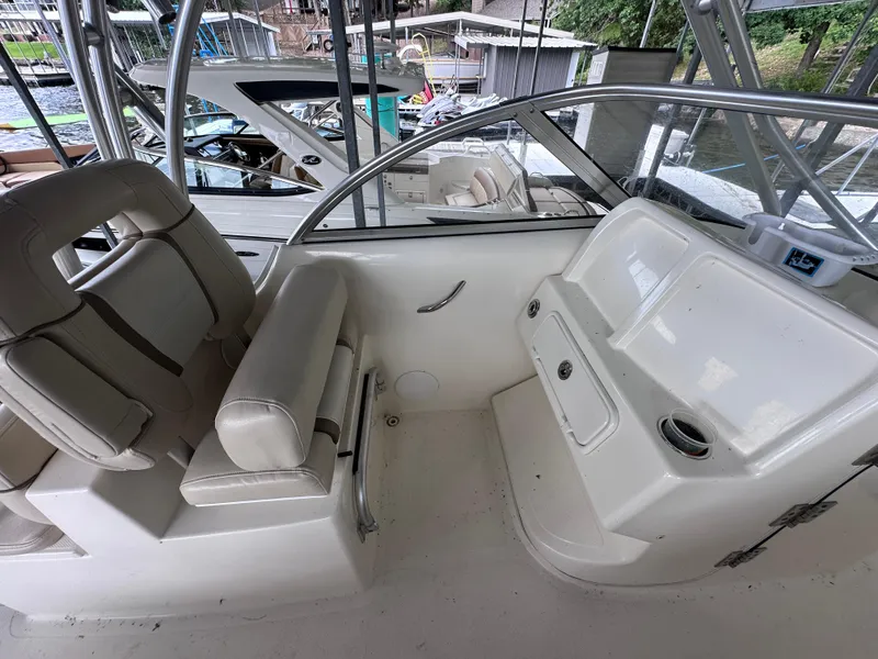 Slide: The Image of Interior of a 2013 World Cat 255 DC boat with seating and console. - 10