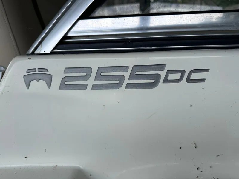 Slide: The Image of 2013 World Cat 255 DC logo on boat exterior. - 32