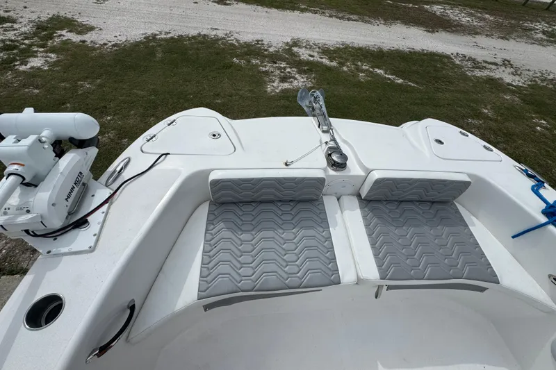Slide: The Image of 2021 Twin Vee 280 CC GF boat with cushioned seating and Minn Kota trolling motor. - 30