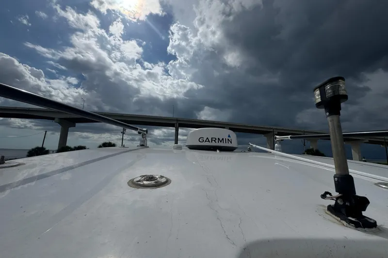 Slide: The Image of 2021 Twin Vee 280 CC GF boat with Garmin equipment under dramatic cloudy sky. - 33