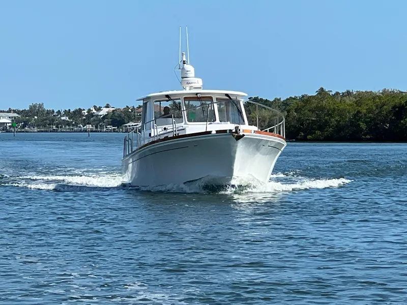 Slide: The Image of 2002 Grand Banks 43 Eastbay HX cruising on a sunny day. - 1