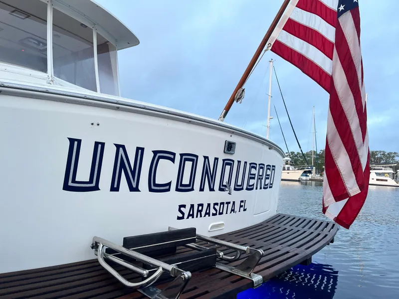 Slide: The Image of Grand Banks 43 Eastbay HX 2002 boat with American flag, Sarasota, FL. - 16