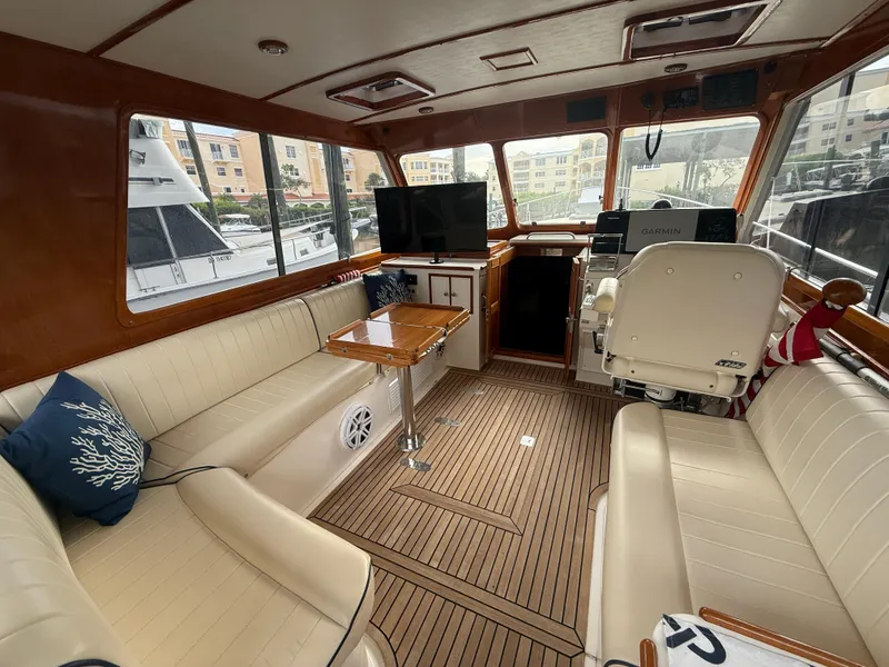 Slide: The Image of Interior of 2002 Grand Banks 43 Eastbay HX yacht with beige seating and wooden accents. - 22