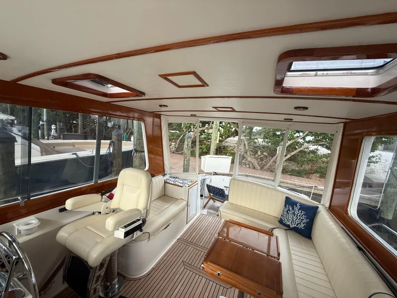 Slide: The Image of Luxurious interior of 2002 Grand Banks 43 Eastbay HX yacht with leather seating and wooden accents. - 24