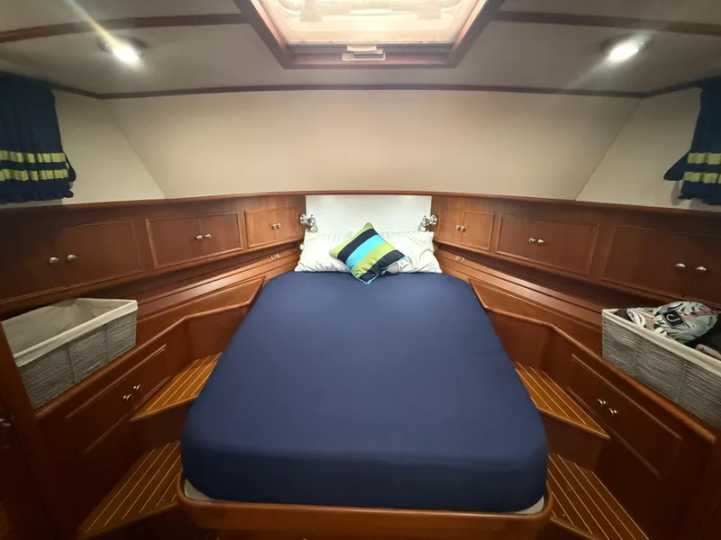 Slide: The Image of Luxurious cabin interior of 2002 Grand Banks 43 Eastbay HX yacht with cozy bedding. - 26
