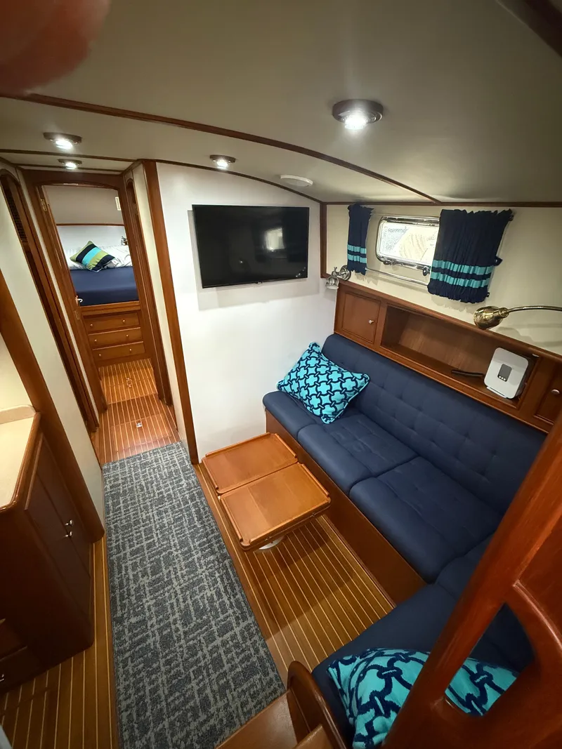 Slide: The Image of Luxurious 2002 Grand Banks 43 Eastbay HX yacht interior with cozy seating and modern amenities. - 36