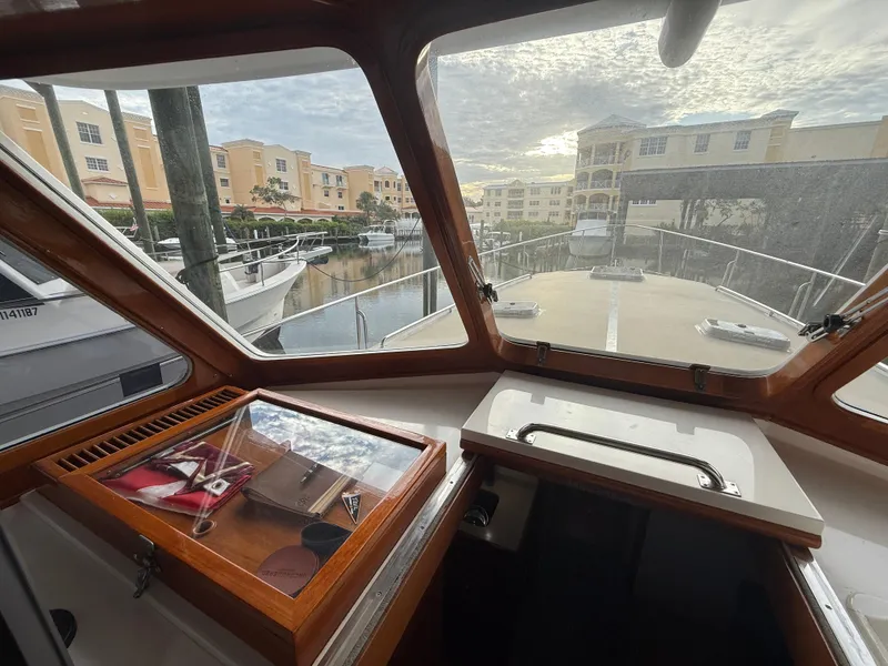 Slide: The Image of Interior view from 2002 Grand Banks 43 Eastbay HX yacht, overlooking marina and buildings. - 38