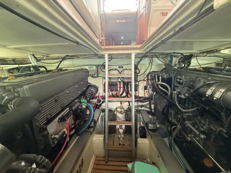 Slide: The Image of Engine room of 2002 Grand Banks 43 Eastbay HX, showcasing dual engines and wiring. - 40