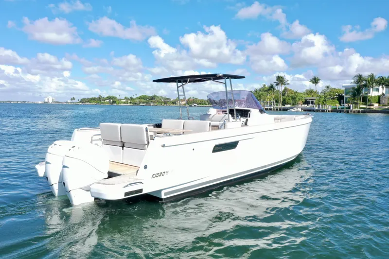 Slide: The Image of 2019 Fjord 36' Open boat cruising on a sunny day with clear skies. - 1