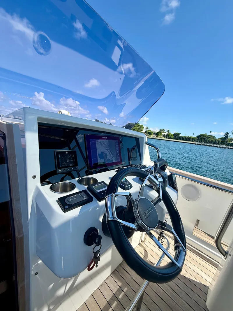 Slide: The Image of Helm of 2019 Fjord 36' Open boat with navigation screens and steering wheel. - 10