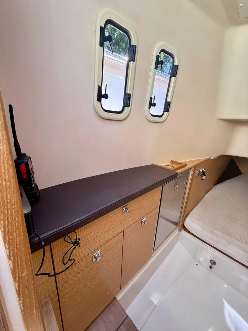 Slide: The Image of Interior cabin of 2019 Fjord 36' Open yacht with storage and portholes. - 17