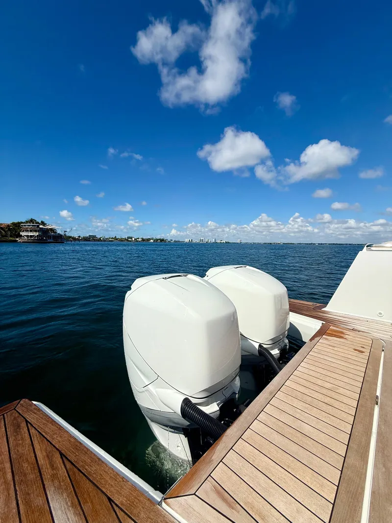 Slide: The Image of 2019 Fjord 36' Open boat with dual outboard engines on a sunny day. - 22
