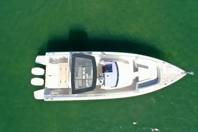 Slide: The Image of Aerial view of 2019 Fjord 36' Open boat on green water. - 4