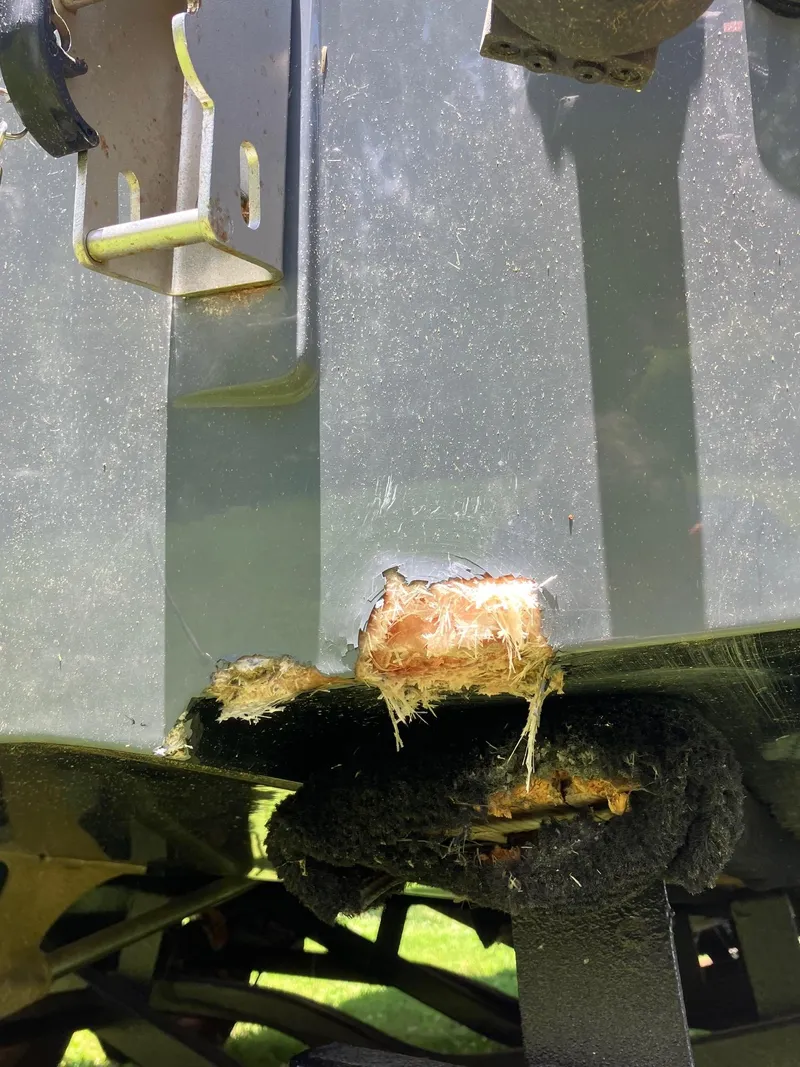 Slide: The Image of Damaged hull of 2019 Malibu Wakesetter 22 MXZ boat showing fiberglass exposure. - 16