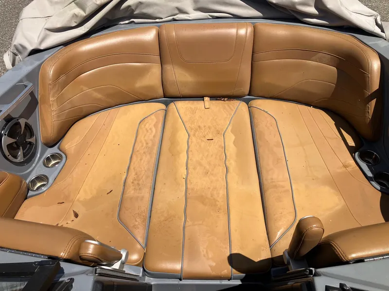 Slide: The Image of 2019 Malibu Wakesetter 22 MXZ boat interior with tan leather seating. - 17