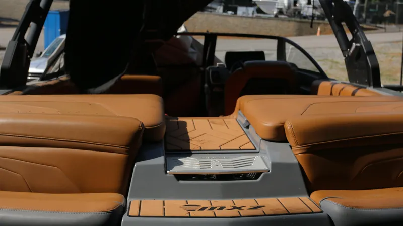 Slide: The Image of 2019 Malibu Wakesetter 22 MXZ interior with tan leather seating and sleek design. - 24