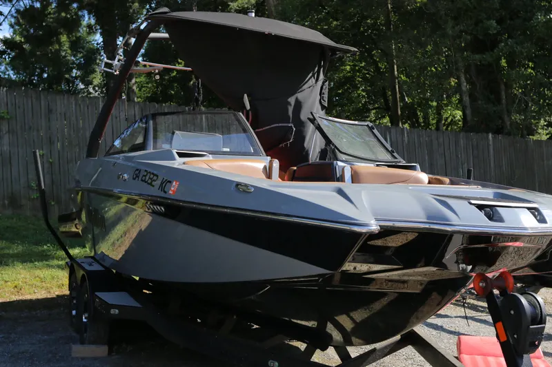 Slide: The Image of 2019 Malibu Wakesetter 22 MXZ boat on trailer, parked outdoors. - 5