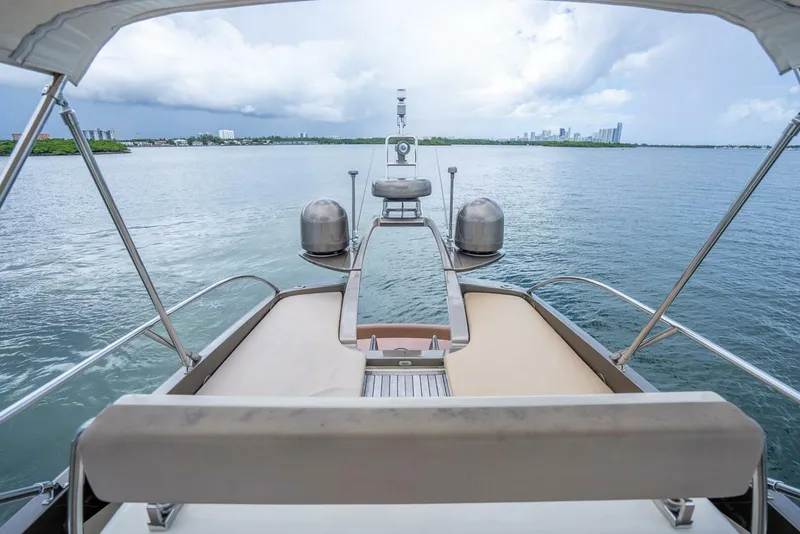 Slide: The Image of 2012 Riva Sport 56 yacht deck overlooking calm waters and distant city skyline. - 14