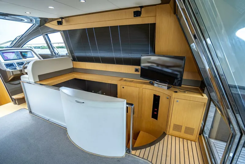 Slide: The Image of Luxurious interior of 2012 Riva Sport 56 yacht with modern helm and entertainment area. - 29