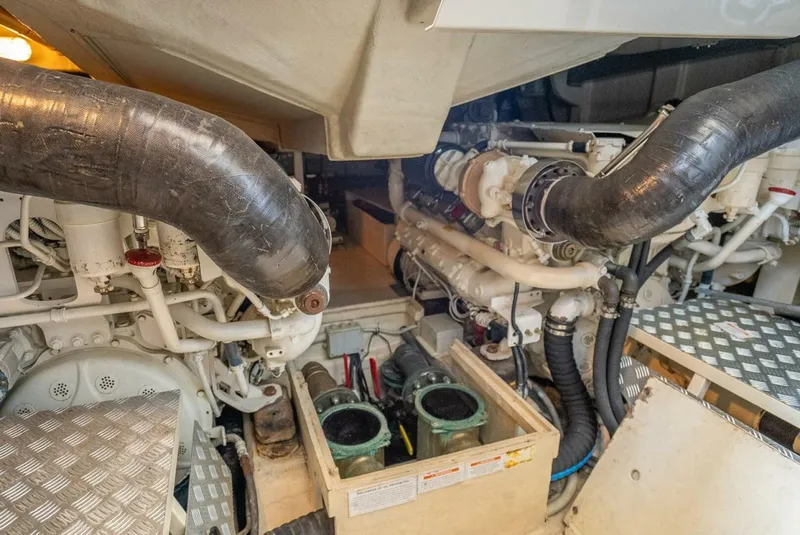 Slide: The Image of Engine room of a 2012 Riva Sport 56 yacht, showcasing mechanical components and piping. - 40