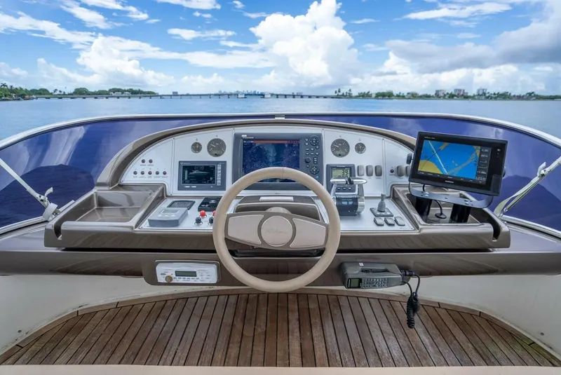 Slide: The Image of Cockpit view of 2012 Riva Sport 56 yacht with navigation equipment and scenic ocean backdrop. - 17
