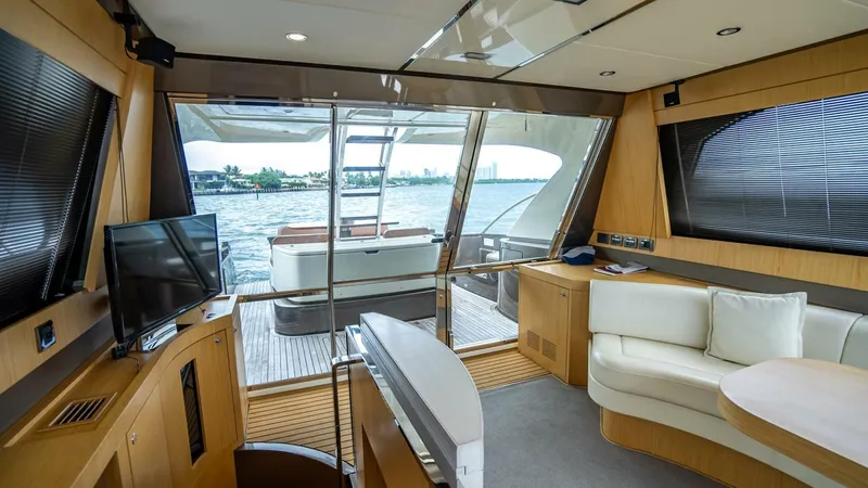 Slide: The Image of Luxurious interior of 2012 Riva Sport 56 yacht with modern furnishings and scenic water view. - 21