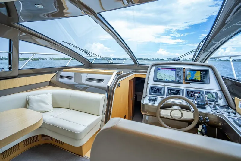 Slide: The Image of Luxurious 2012 Riva Sport 56 yacht interior with modern navigation system and plush seating. - 22