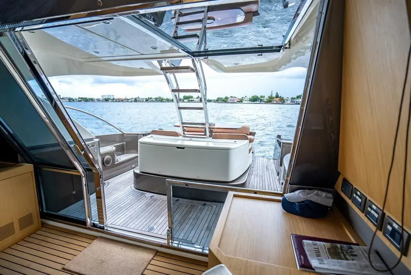 Slide: The Image of Luxurious 2012 Riva Sport 56 yacht interior with open deck view of the water. - 27