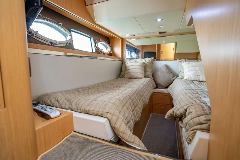 Slide: The Image of Luxurious cabin interior of 2012 Riva Sport 56 yacht with twin beds and elegant decor. - 32