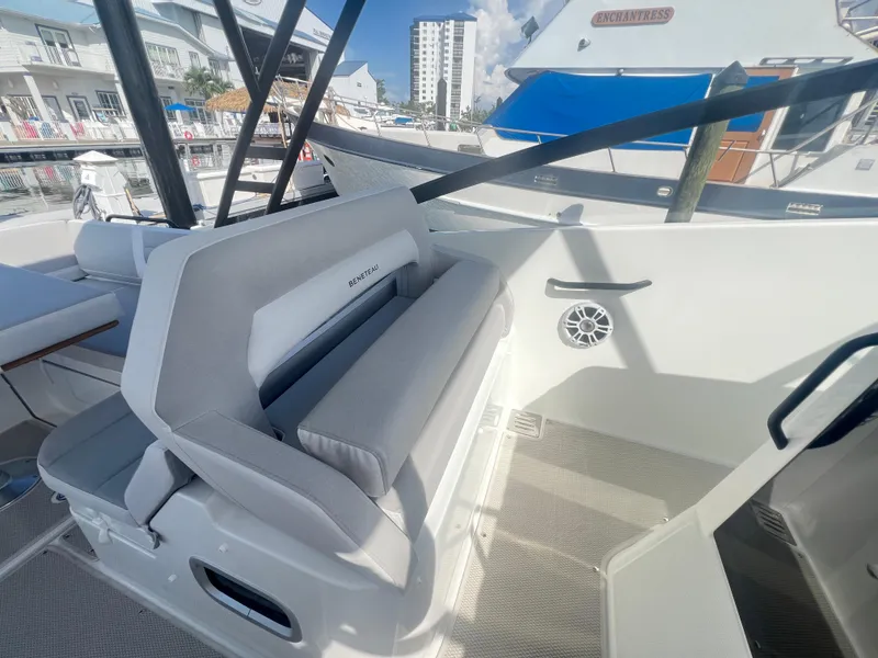 Slide: The Image of 2025 Beneteau Flyer 10 boat interior with cushioned seating and modern design. - 12