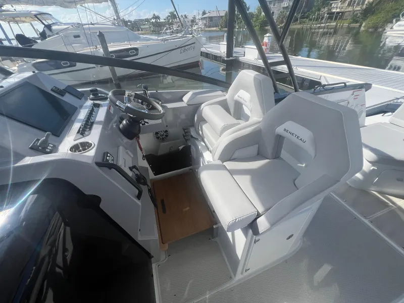 Slide: The Image of 2025 Beneteau Flyer 10 cockpit with modern helm and dual seating. - 13