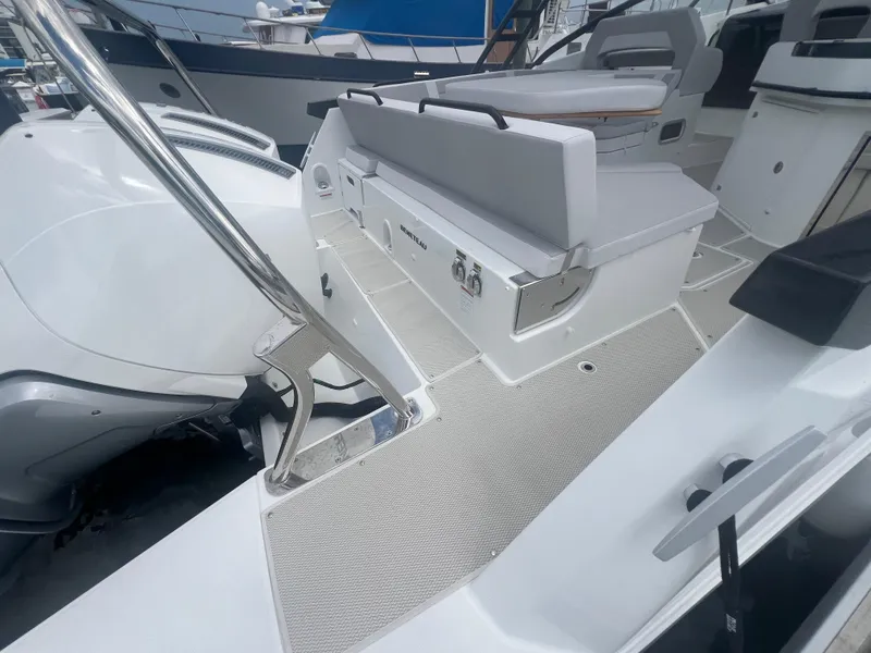 Slide: The Image of 2025 Beneteau Flyer 10 boat deck with seating and modern design. - 20