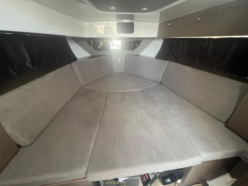 Slide: The Image of 2025 Beneteau Flyer 10 interior cabin with spacious seating and modern design. - 22