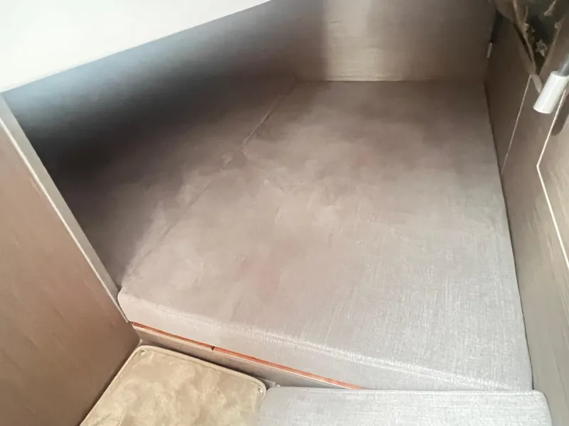 Slide: The Image of Interior cabin of 2025 Beneteau Flyer 10, featuring a cozy sleeping area. - 23