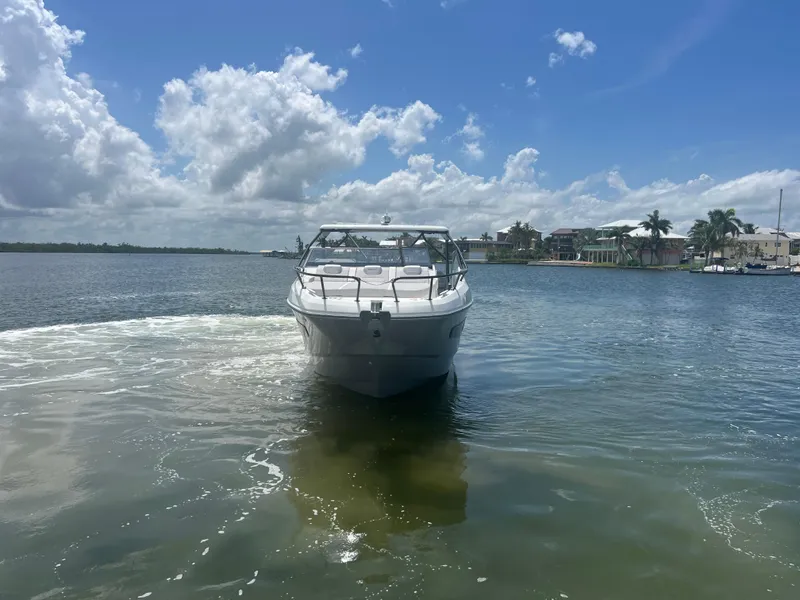 Slide: The Image of 2025 Beneteau Flyer 10 boat on a sunny day, cruising in calm waters. - 3