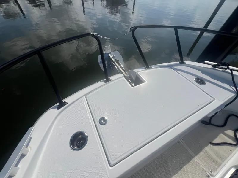 Slide: The Image of Bow of 2025 Beneteau Flyer 10, featuring sleek design and water reflections. - 8