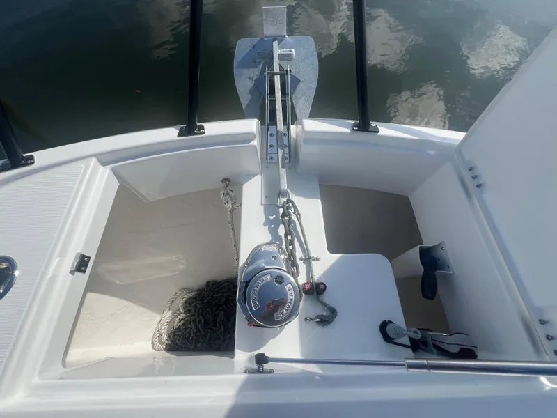 Slide: The Image of Anchor compartment of 2025 Beneteau Flyer 10 boat with chain and winch. - 9