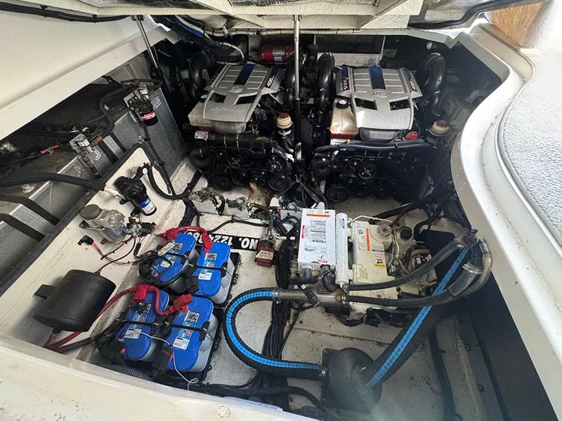 Slide: The Image of Engine compartment of a 2009 Sea Ray 330 Sundancer with dual engines and batteries. - 17