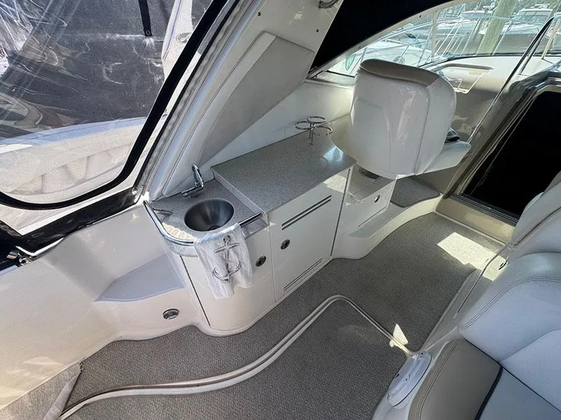 Slide: The Image of Interior of 2009 Sea Ray 330 Sundancer yacht with sink and seating area. - 6
