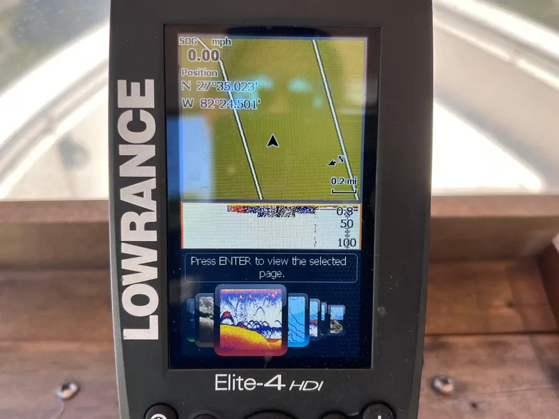 Slide: The Image of Lowrance Elite-4 HDI fishfinder displaying navigation and sonar data on a Scout 185 Sportfish. - 15