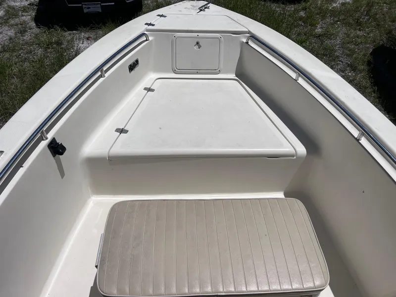 Slide: The Image of 2000 Scout 185 Sportfish boat interior with seating and storage compartments. - 17