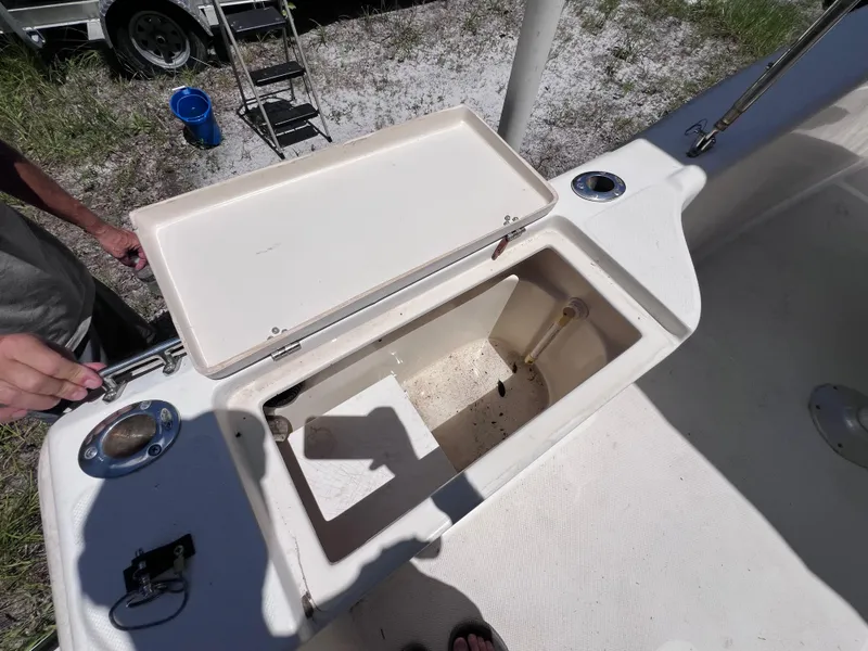 Slide: The Image of Open storage compartment on a 2000 Scout 185 Sportfish boat, showing interior details. - 26