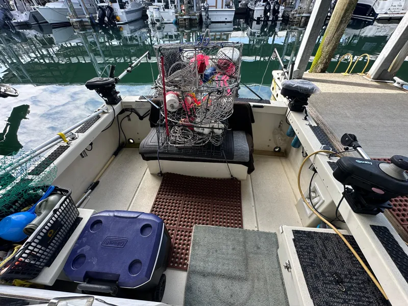 Slide: The Image of 2007 Rosborough R-246 boat interior with fishing gear and equipment at a marina. - 5