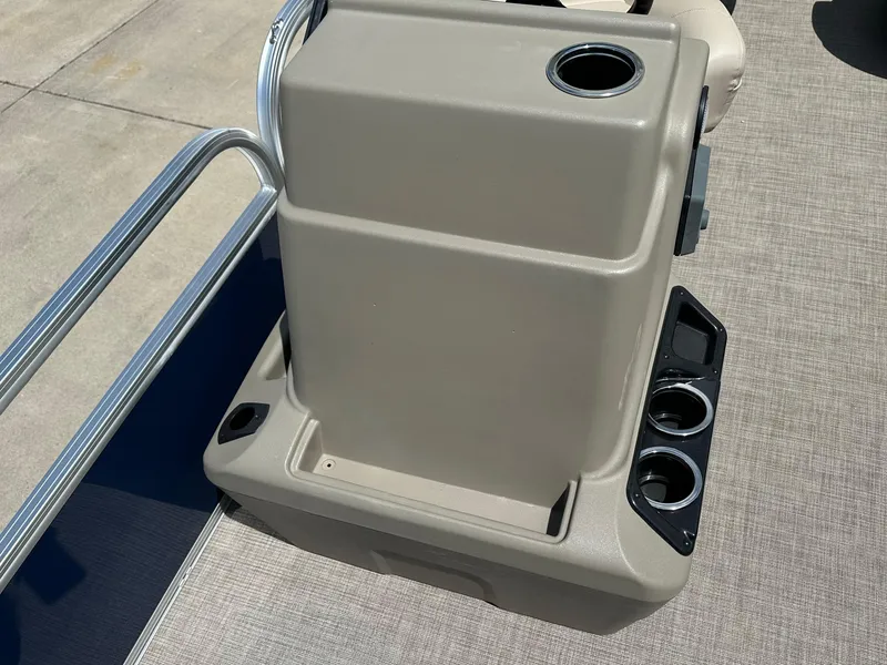 Slide: The Image of 2025 Sun Tracker Bass Buggy 18 DLX console with cup holders and storage compartments. - 15