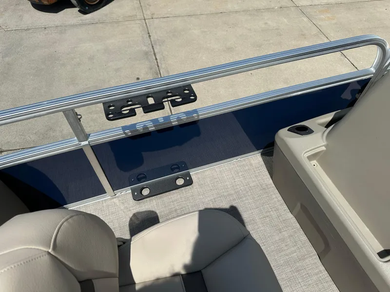 Slide: The Image of 2025 Sun Tracker Bass Buggy 18 DLX interior with seating and railing detail. - 16