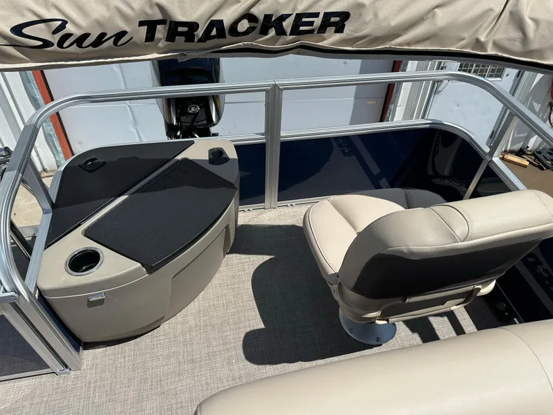 Slide: The Image of 2025 Sun Tracker Bass Buggy 18 DLX interior with seating and console. - 24