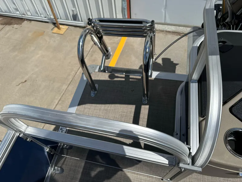 Slide: The Image of 2025 Sun Tracker Bass Buggy 18 DLX boat ladder and deck detail. - 26