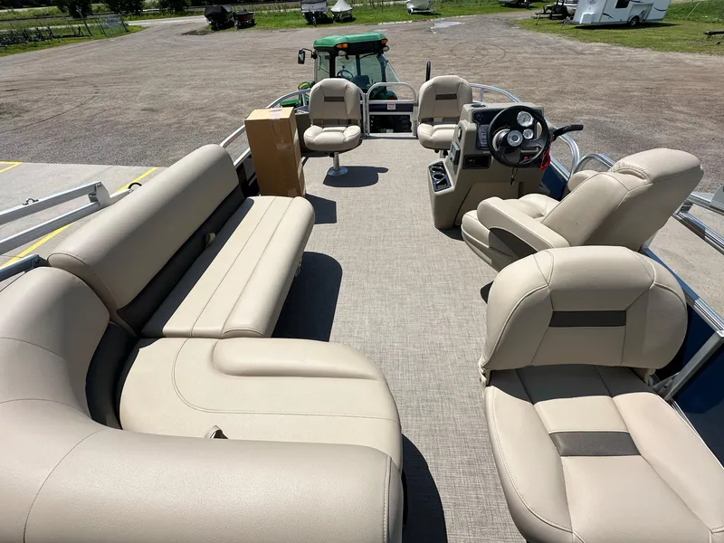 Slide: The Image of 2025 Sun Tracker Bass Buggy 18 DLX pontoon boat with spacious seating and modern dashboard. - 28